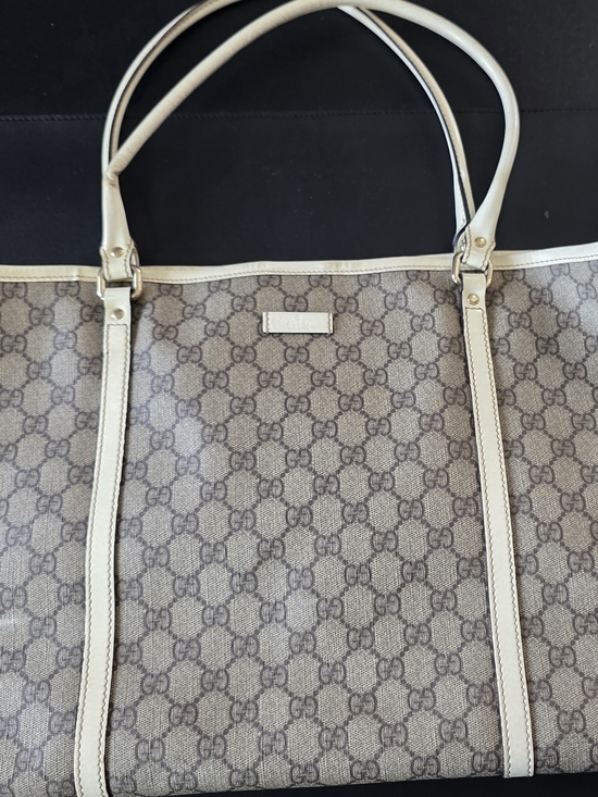 Gucci Handbags - Authentic Gucci Brown and Cream GG Monogram Canvas Pouch with Leather Trim